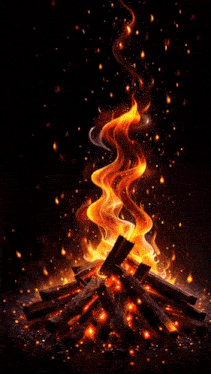 a fire is burning in the dark with a lot of flames coming out of it