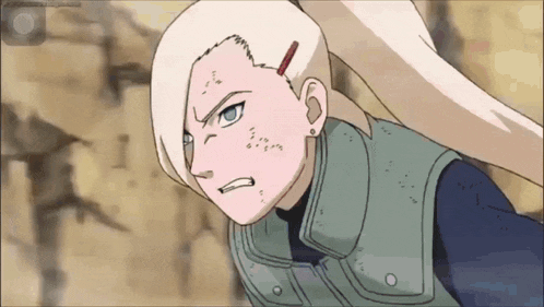 a cartoon character with blonde hair and blue eyes is looking at the camera with an angry look on her face .