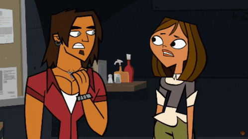 a man and a woman are standing next to each other in front of a bulletin board