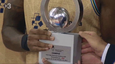 a man holding a trophy with the number 3 on the bottom
