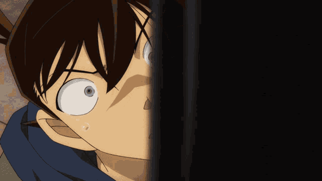 a close up of a person 's face with a surprised look on his face