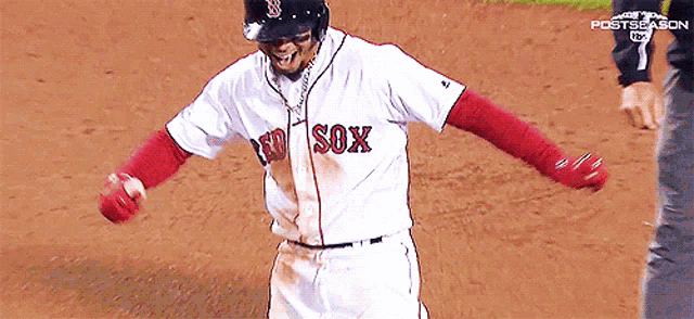 a baseball player wearing a red sox jersey is standing on the field