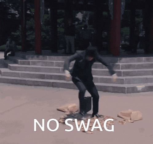 a man is standing on a pile of bricks with the words no swag written below him