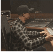 two men are standing next to each other in a room in a video game
