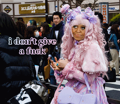 a woman in a pink and purple outfit says i don 't give a fuck in a crowd