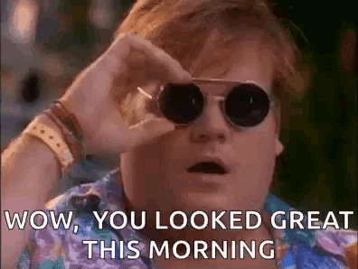 a man wearing sunglasses is looking through a pair of binoculars and says wow , you looked great this morning .
