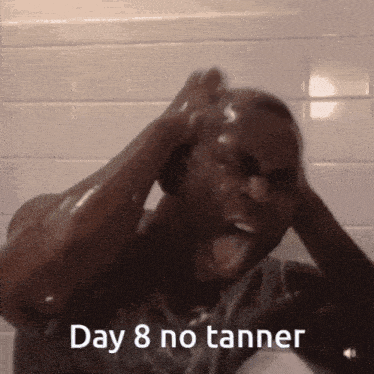 a man is taking a shower with the words day 8 no tanner on the bottom