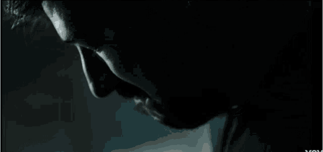 a close up of a man 's face with the word you on the bottom left
