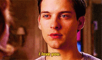 a close up of a man 's face with the words `` i love you '' written on the bottom .
