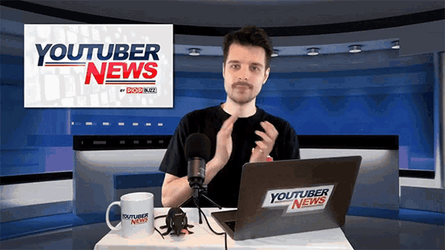 a man is sitting in front of a laptop that says youtuber news