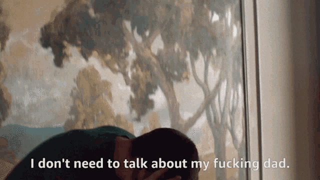 a man kissing another man with the words i don t need to talk about my fucking dad