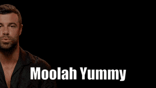 a man in a black shirt with the name moolah yummy written on it