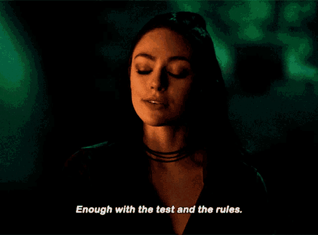 a woman says " enough with the test and the rules " in front of a green background