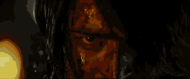 a close up of a person 's face with blood on it
