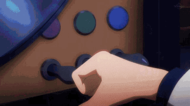a person 's hand is pressing a button on a machine