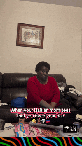 a woman in a red shirt sits on a couch with the words when your haitian mom sees that you dyed your hair below her