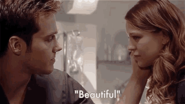 a man and a woman are looking at each other and the woman is crying while the man says `` beautiful '' .