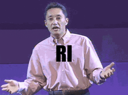 a man in a pink shirt with the word ri on his shirt