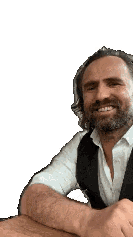 a man with a beard and long hair is smiling