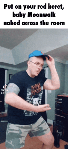 a man is dancing in a room with the caption put on your red beret baby moonwalk naked across the room