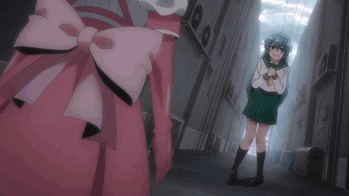 a girl in a pink dress is standing next to another girl