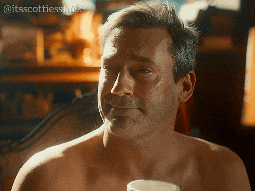 a man without a shirt is holding a cup of coffee with the caption @itsscottiesstark above him