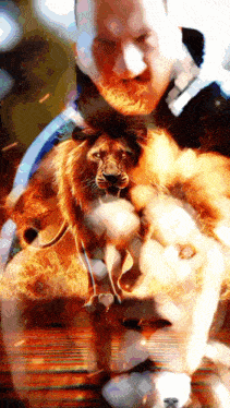 a man is holding a lion with flames coming out of it 's mouth