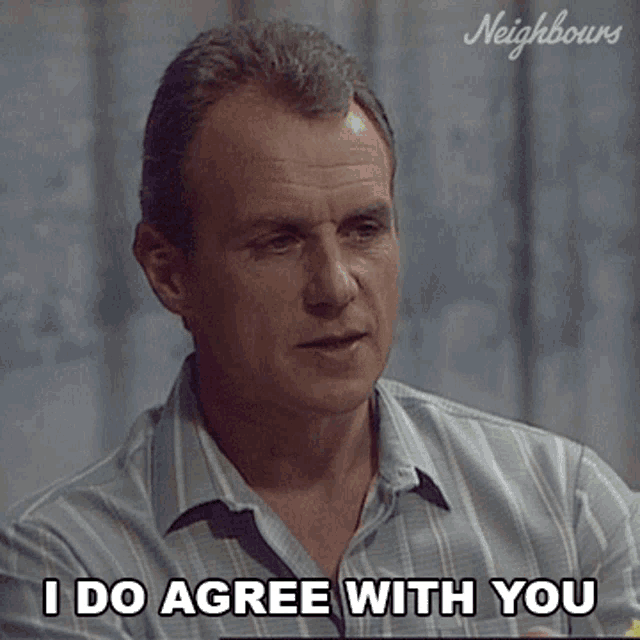a man says " i do agree with you " while holding a piece of fruit