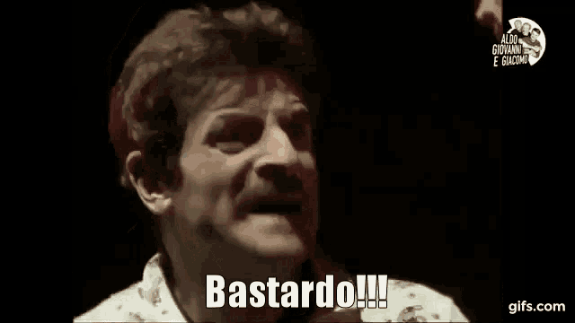 a man with a mustache is making a funny face and saying bastard !