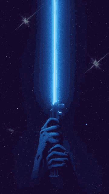 a person holding a blue light saber in a dark space