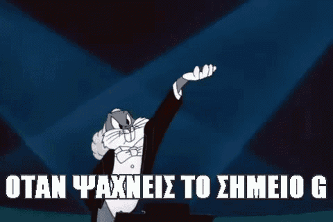 bugs bunny is wearing a tuxedo and bow tie and is standing on a stage with his hand up .