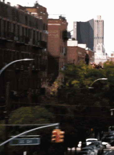 a blurry picture of a city street with a sign that says one way on it