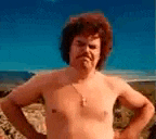 a shirtless man is standing with his hands on his hips .