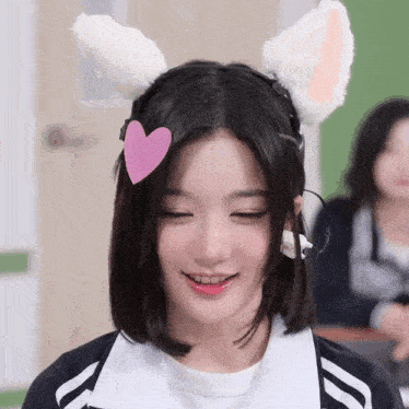 a girl with bunny ears and a heart on her head