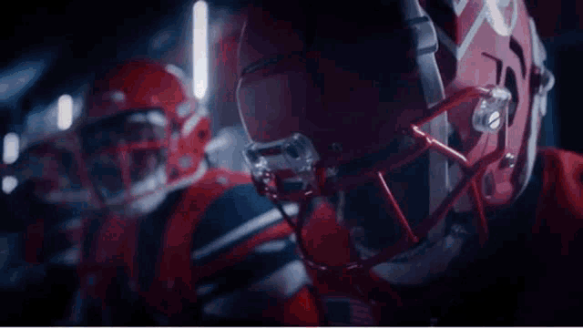 a football player wearing a helmet with the word rise written above him