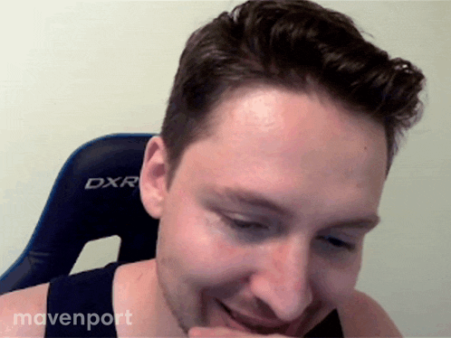a man sitting in a dxr chair laughing