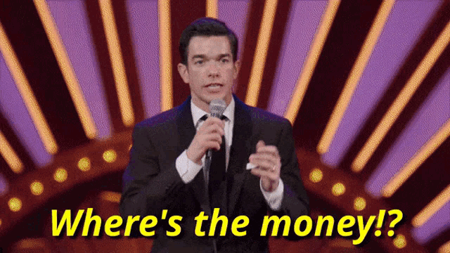 a man speaking into a microphone with the words where 's the money