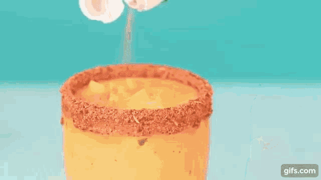 a drink with a straw in it and the words enjoy tajin on it