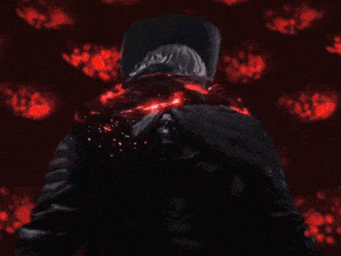 a close up of a person holding a sword in their hand