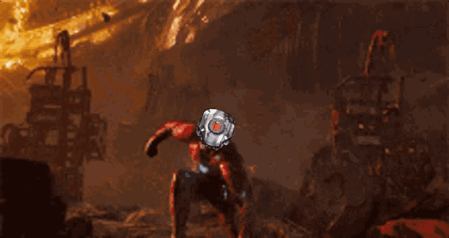 a man in a red suit with a robotic head on his head