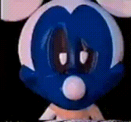 a close up of a blue and white mickey mouse