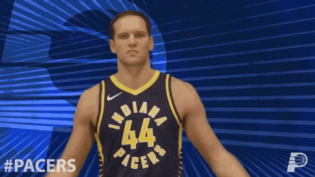 a basketball player for the indiana pacers flexing his muscles