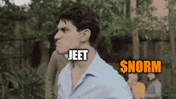 a man in a blue shirt with jeet and $ norm written on his face