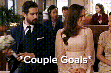 a man and a woman are sitting in a church with the words couple goals written below them
