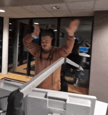 a man wearing headphones and a sweater that says ' security '