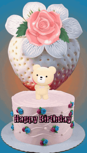 a happy birthday cake with a teddy bear and flowers