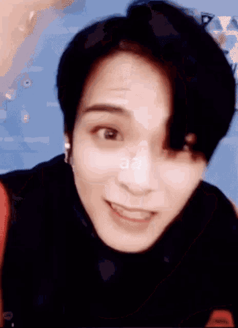 a close up of a person 's face with a smile on it