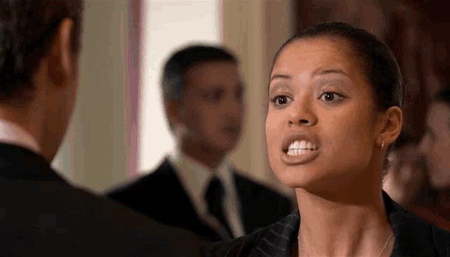 a woman with braces on her teeth is making a funny face