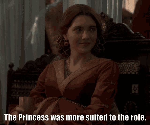 a woman in a red dress is sitting in a chair with the words " the princess was more suited to the role " written below her