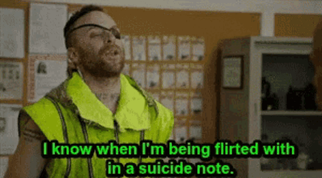 a man wearing a yellow vest and goggles is talking about being flirted with in a suicide note